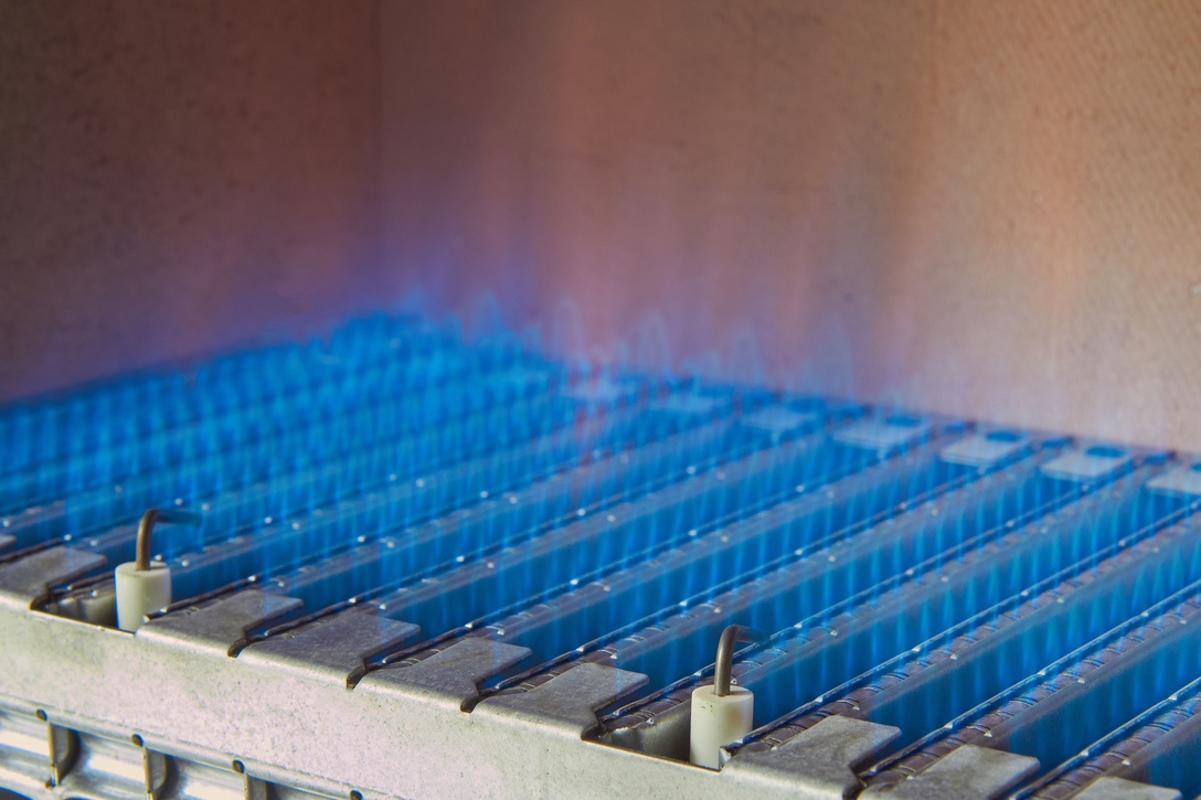 Blue flames from natural gas burner in central furnace